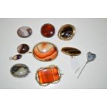 A large quantity of banded agate and other stone brooches.