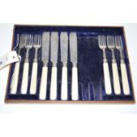 Six fish forks and four knives, the silver prongs and blades Sheffield 1895, fitted ivory handles.