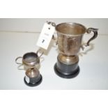 A pair of silver trophy cups, each with scrolling handles and Masonic golf challenge inscription,