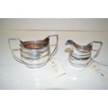 A silver milk jug and sugar bowl, by Martin Hall & Co.