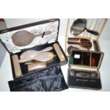 A silver backed dressing table set by Adie Bros.