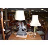 A bronze effect spelter table lamp in the form of a mounted knight in armour,
