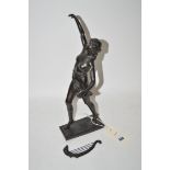 A pewter figure modelled as a semi-nude female, holding a stringed instrument (instrument detached).