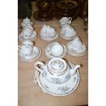 A Royal Grafton bone china part afternoon tea set, with floral and gilt decoration on white ground.