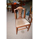 A set of six George III mahogany dining chairs, the serpentine cresting rail above pierced splat,