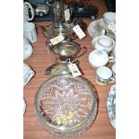 A three-piece silver plated tea service; a coffee pot; and a cut glass salad bowl with plated rim.