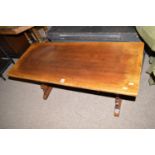 A mid 20th Century oak coffee table with rectangular top,