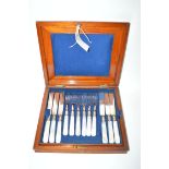 A set of twelve desert knives and forks with mother-of-pearl handles,