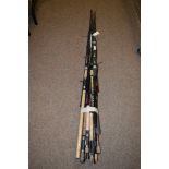 A bundle of miscellaneous carbon composite fishing rods, and rod sections.