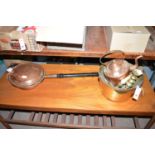 A copper bed warming pan with turned wooden handle; a brass jam pan; a copper kettle;