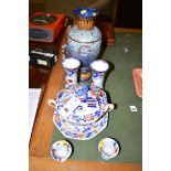 A 19th Century Ironstone two-handled tureen and cover with matching stand;