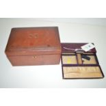 A purple leather and white metal clasp jewellery box with fitted interior;