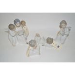 Four Lladro figures of angels.