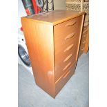 A modern veneered chest of six graduated drawers with shaped handles.