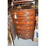 A mahogany bowfront chest of six graduating drawers, raised on bracket feet.