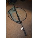 A modern folding landing net with shoulder strap.