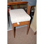 An Edwardian inlaid mahogany piano stool with upholstered hinged top,