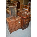 A reproduction mahogany serpentine front bachelor's chest, the moulded top above a brushing slide,