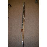 Two boat rods; and other miscellaneous fishing rods in a bundle.