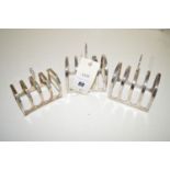 Three five bar silver toast racks.