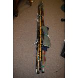 A collection of nine fishing rods, various, for fly fishing and spinning; and three rod slips.