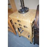 A modern butcher's block style kitchen table, fitted five drawers above an undertier,