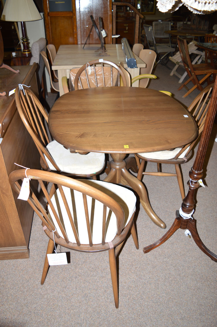 An Ercol dining suite in dark stained elm, - Image 2 of 2