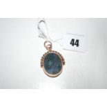 A 9ct. gold mounted bloodstone swivel fob pendant.