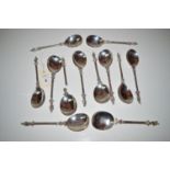 A set of twelve cast white metal apostle serving spoons in the West Country style, with oval bowls,