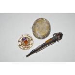 A citrine, amethyst and seed pearl set yellow metal thistle pattern roundel brooch, stamped '9ct.