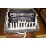 A Cook L'Armonica Stradella piano accordion in case.