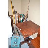 A stained wood table on centre stalk; and a corner table with shelf under.