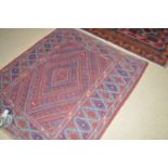 A Kazak rug with diamond-shaped medallion field, 44 x 48in.