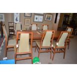 Manner of John Stuart: a set of eight rosewood dining chairs, upholstered seat and shaped back rest,
