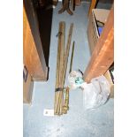 A quantity of brass stair rods; a brass poker; and stair rod clips.