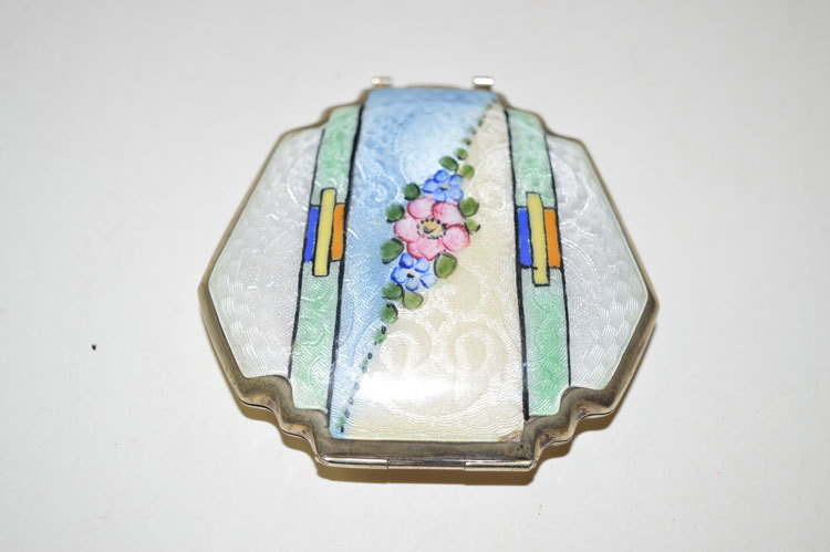 A Art Deco enamelled white metal compact,