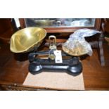 A pair of brass and metal kitchen scales; together with a set of brass weights.