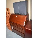 A Stag mahogany bureau, fitted three short and two long drawers.