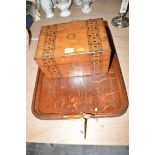 A rectangular walnut veneered box opening to reveal an interior fitted as a jewellery case;