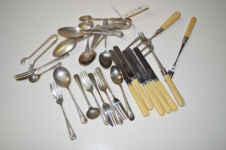 A quantity of silver teaspoons; two desert spoons; a pair of sugar tongs;