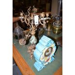 An ornate cast, brass and ceramic five-branch candelabra (damaged); a mantel clock in ceramic case,