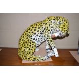 A large pottery model of a leopard.