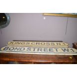 Two carved wood street boards: Kings Cross N1; and Bond Street W1.