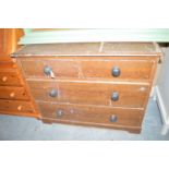 A Victorian scumble chest of two short and two long drawers with turned knob handles.