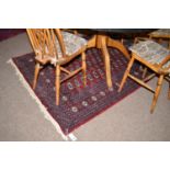 A pair of Turkoman rugs with tekke gul design to field and multiple border.