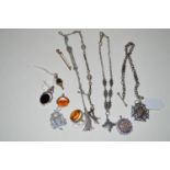 A quantity of silver watch chains; fobs; a gilt metal watch key; an onyx set swivel fob;