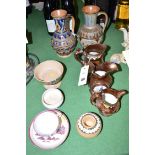 Two Doulton Lambeth ewers; copper lustre jugs; Sunderland lustre teacup and saucer; etc.