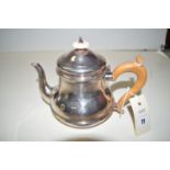 A silver teapot, Birmingham 1912, with bone finial and scrolling wooden handle, 12oz. gross.