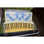 A Scott-Wood six Scandalli piano accordion in case.