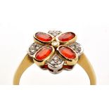 An orange stone and diamond dress ring,